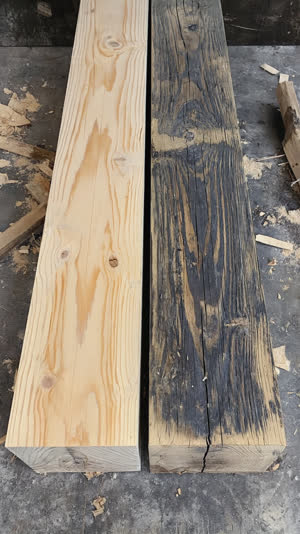 A pale freshly cut timber beam set beside a dark aged one during a Japanese building repair, contrast of new and old wood, photorealistic documentary photograph, natural soft…