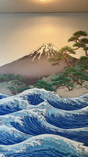Detail of a painted bathhouse mural showing pine trees and ocean waves beside Mount Fuji, layered paint colors, traditional sento art style, soft interior light