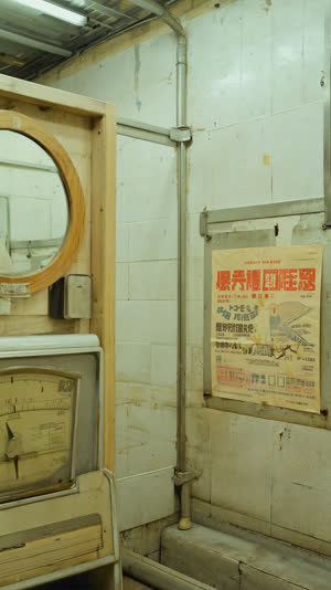Corner of a Showa-era bathhouse changing room with vintage analog scale, round mirror and retro advertisement posters, aged nostalgic atmosphere