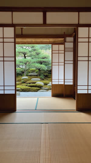 Inside a traditional teahouse room with tatami and soft shoji light, garden view through the open side, tranquil, photorealistic documentary photograph, natural soft light, muted…