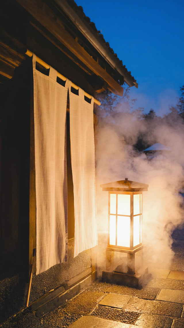 Quiet onsen entrance with noren curtain and a small notice board, drifting steam, evening lantern light, contemplative mood